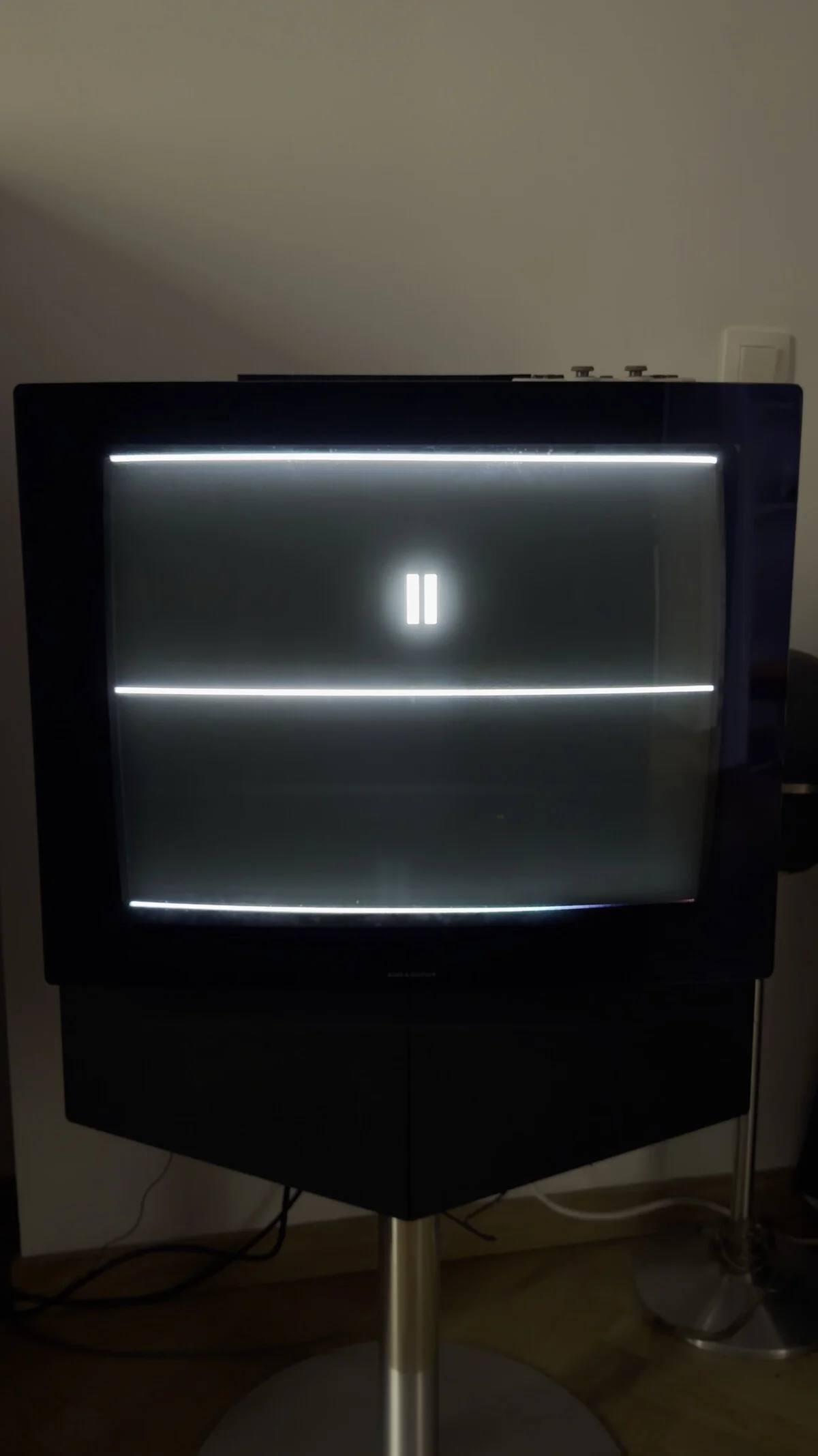 The measuring instrument's own test card on the television, with the clapper it uses to synchronise a film with the timestamps